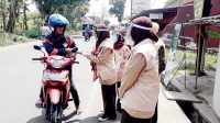 Pramuka SMK Ma’arif Al-Fathonah Bagikan Masker