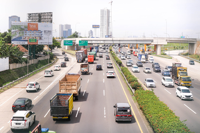 Ilustrasi kendaraan yang melintasi Tol
