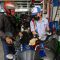 Warga dibantu petugas melakukan pengisian bahan bakar