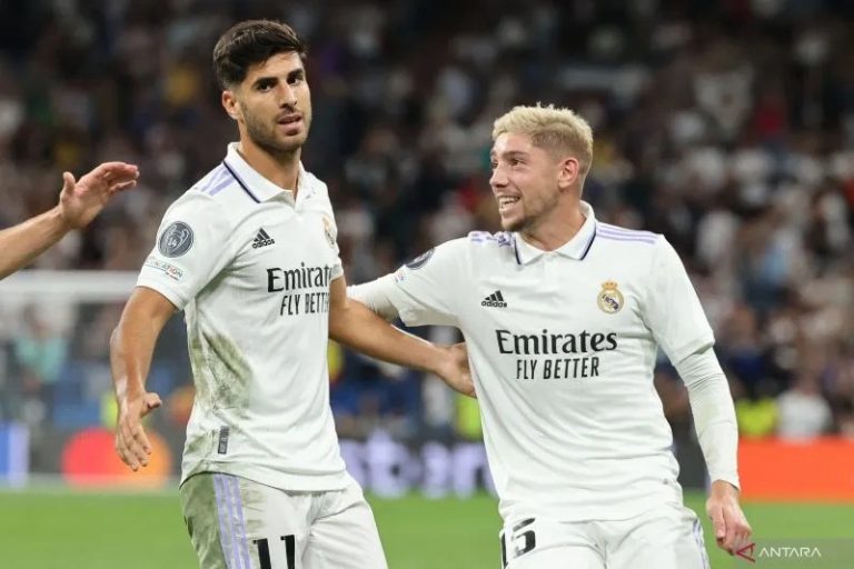 Selebrasi Marco Asensio (kiri) usai