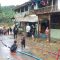 Suasana saat petugas membersihkan material lumpur yang menutup jalan di kampung Cinitih, desa Cibitung,