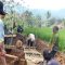 Warga saat melakukan gotong royong membuat jembatan dari Bambu