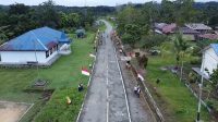 Satgas Yonif 310/KK Sukabumi Merah Putihkan Jalan di Perbatasan Papua