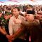 Menteri Pertahanan Prabowo Subianto menyapa warga usai penyerahan bantuan pipa buatan Universitas Pertahanan di Desa Karanganyar, Kabupaten Sukabumi, Jawa Barat, Sabtu (30/12/2023). 