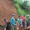 Warga Kampung Cimeri, RT 03/01, Desa Cianaga, Kecamatan Kabandungan tengah bergotong royong membuka akses jalan yang tertimbun longsor pada Jumat, (1/12/2023).
