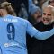 Pelatih Manchester City Pep Guardiola bersama striker Erling Haaland.(AFP/PAUL ELLIS)