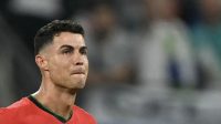 Reaksi penyerang Portugal #07 Cristiano Ronaldo setelah gagal mencetak tendangan penalti pada pertandingan sepak bola babak 16 besar UEFA Euro 2024 antara Portugal dan Slovenia di Frankfurt Arena di Frankfurt pada Senin (1/7/2024). (AFP/Patricia De Melo Moreira)