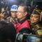 Menteri Perdagangan tahun 2015-2016 Thomas Lembong dibawa menuju mobil tahanan di Kejaksaan Agung, Jakarta, Selasa (29/10/2024). (Miftahul Hayat/ Jawa Pos)