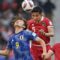 Pesepak bola Timnas Indonesia Rizky Ridho Ramadhani (tengah) dan Sandy Walsh (kanan) berebut bola dengan pesepak bola Timnas Jepang Ayase Ueda (kiri) saat bertanding pada penyisihan grup D Piala Asia 2023 di Stadion Al Thumama, Doha, Qatar, Rabu (24/1/2024)