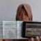 Seorang warga memperlihatkan bukti pelunasan pajak kendaraan bermotor yang dibayar secara daring atau online dari rumah di Panarukan, Situbondo, Jawa Timur.