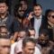 Warga menyaksikan jalannya sidang pengucapan putusan sela (dismissal) sengketa Pilkada 2024 dari layar lebar di halaman Gedung Mahkamah Konstitusi, Jakarta, Selasa (4/2/2025). (BAYU PRATAMA S)
