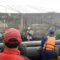 Sejumlah warga menyaksikan proses evakuasi korban terdampak banjir di Perumahan Pondok Gede Permai Jatiasih, Kota Bekasi dari area titik aman, Selasa siang. (Pradita Kurniawan Syah).