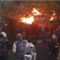 Massa berkumpul di depan Wisma MPR di Bandung yang terbakar. (Bagus Ismail)