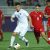 Penyerang Uzbekistan Khusayin Norchaev dijaga pemain Indonesia pada semifinal AFC U-23 di Abdullah Bin Khalifa Stadium, Doha, Senin (29/4/2024). (AFP/KARIM JAAFAR)